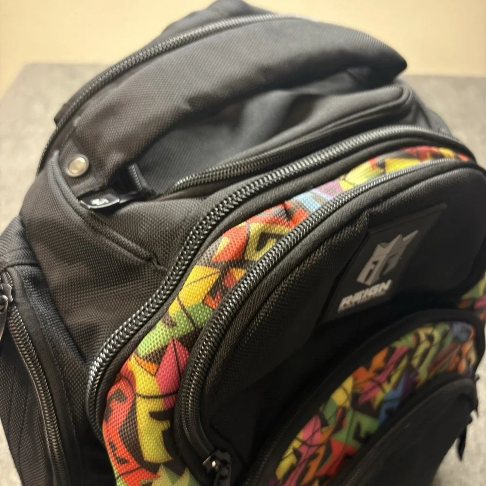 REIGN Total Body Fuel Backpack Black w/ Colorful Graffiti Accents‎ Multi Pocket